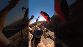 Man Glides Through Mountain Peaks with Speedwing in Breathtaking View
