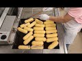 Frying Long John Donuts