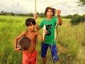 Cambodian Boys Fishing in the Field in the Rural Area