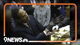 O.J. Simpson puts on gloves in court