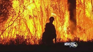 Firefighters Setting Backfires to Stop Highway Blaze
