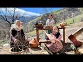 Cooking lamb chigirtma with potatoes and eggplant in mountain village