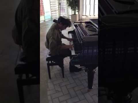 ukranian soldier plaaying piano