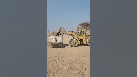 Feel the Power & Precision of Caterpillar 966F Wheel Loader: Loading Huge Rock into Trolley #shorts