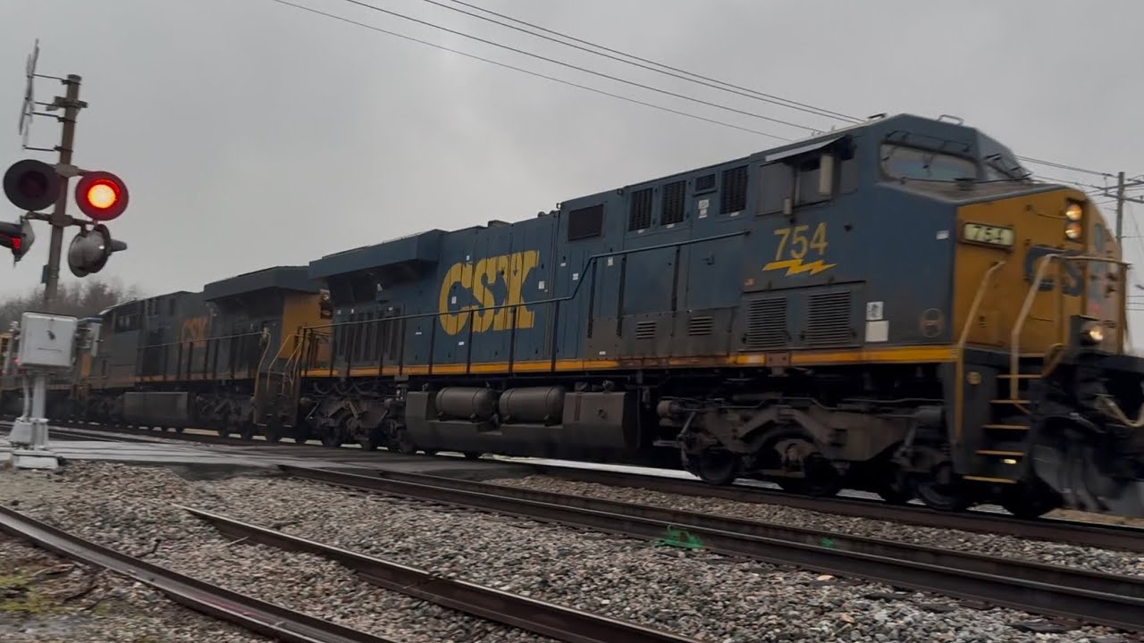 CSXT 754 leads a manifest in cold foggy weather with a CSX SD40-2 trailing 3rd