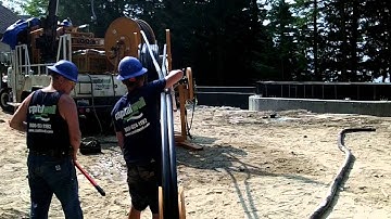 Setting the Geoththermal Grout Loops for a closed loop system.