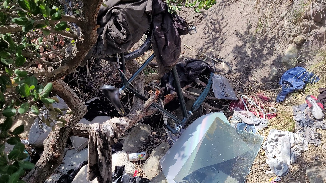 Little trashed campsite along pacific coast highway heading towards malibu