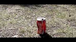 Time Warp Rock on a coca cola bottle, in Slowmotion