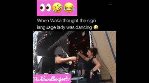 Waka Flocka turnt up with sign language lady on side of the stage