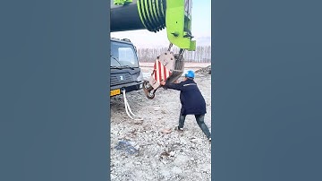 The process of a crane operator securing the hook. #machine #workers