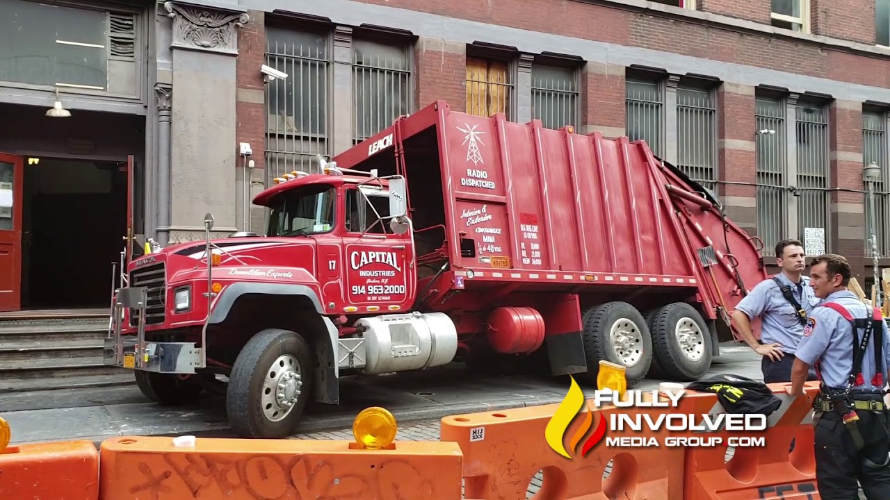 Manhattan,NY: Garbage Truck Falls into Sidewalk Vault Missing Building