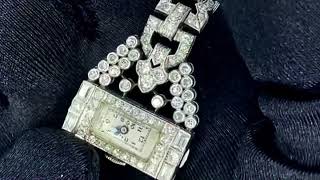 Vidéo: Broche Montre Dame Art déco en platine et diamants taille ancienne. Mécanique.