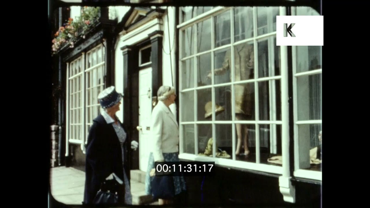 1960s UK, Window Shopping, High Street, Shop Fronts, 16mm