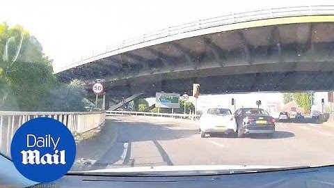 Which car is in the wrong here? Roundabout crash causes debate - Daily Mail