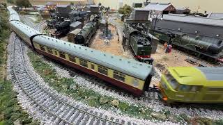 Falcon pulling Blood and Custard Coaches over a Peco Streamlined points crossover. @PaulBriden