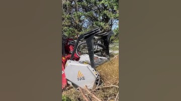Forestry mulcher destroys brush pile in slow mo. This is a FAE mulcher on a Takeuchi TL12R2