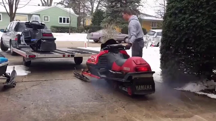 Loading 2 Yamaha  Snowmobiles  and 1 Arctic Cat On A 2 Place Trailer By Yourself !