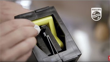 De zetgroep van de Philips espresso machine smeren