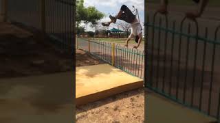 Kid flips over fence and lands on his back