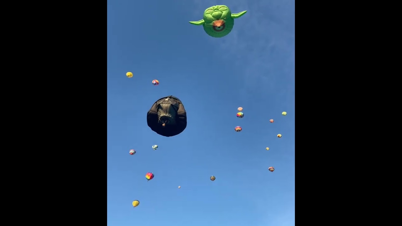Darth Vader and Yoda Balloons Flying, among Many Others, in the Sky
