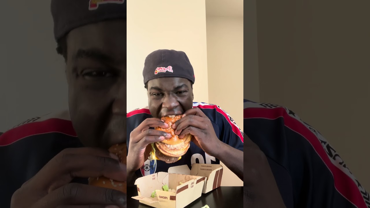 African boy eats Big Mac for the first time