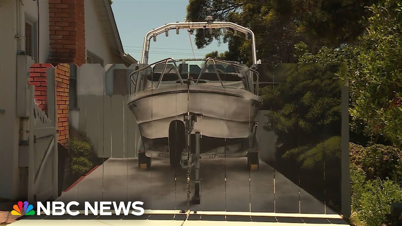 Man has a mural painted of his boat ‘hidden’ behind a fence on his driveway