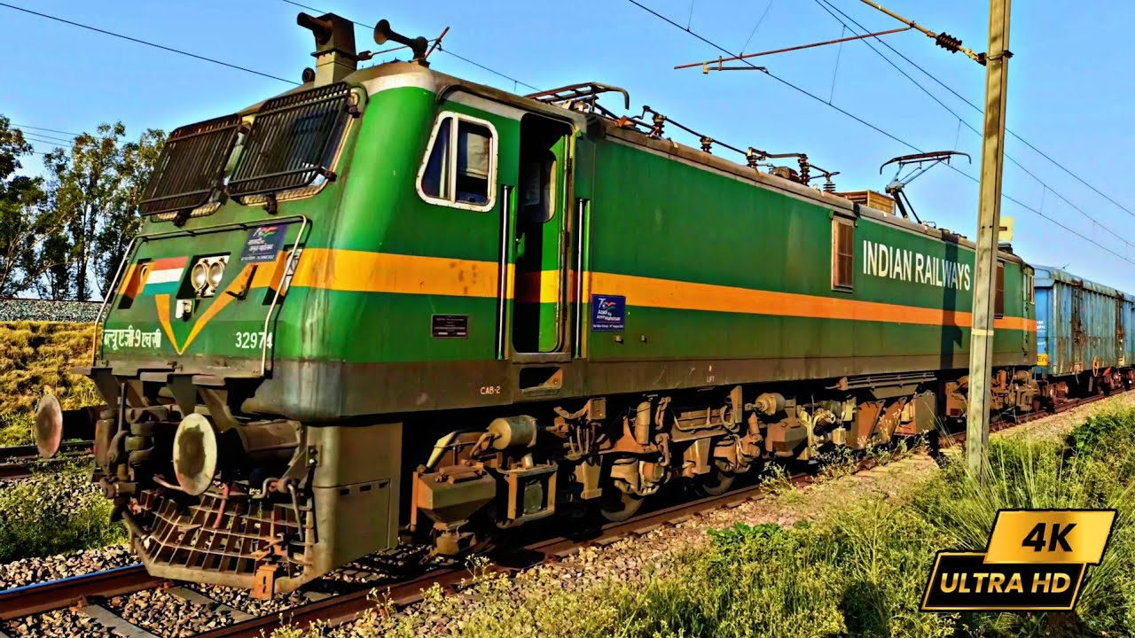 "The Serene Commander: Boss of Indian Railways' WAG9 Unwinds with BCNA Wagons"