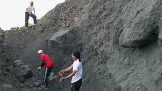 They Lowered The Sand From The Cliff Where There Were Two Large Rocks