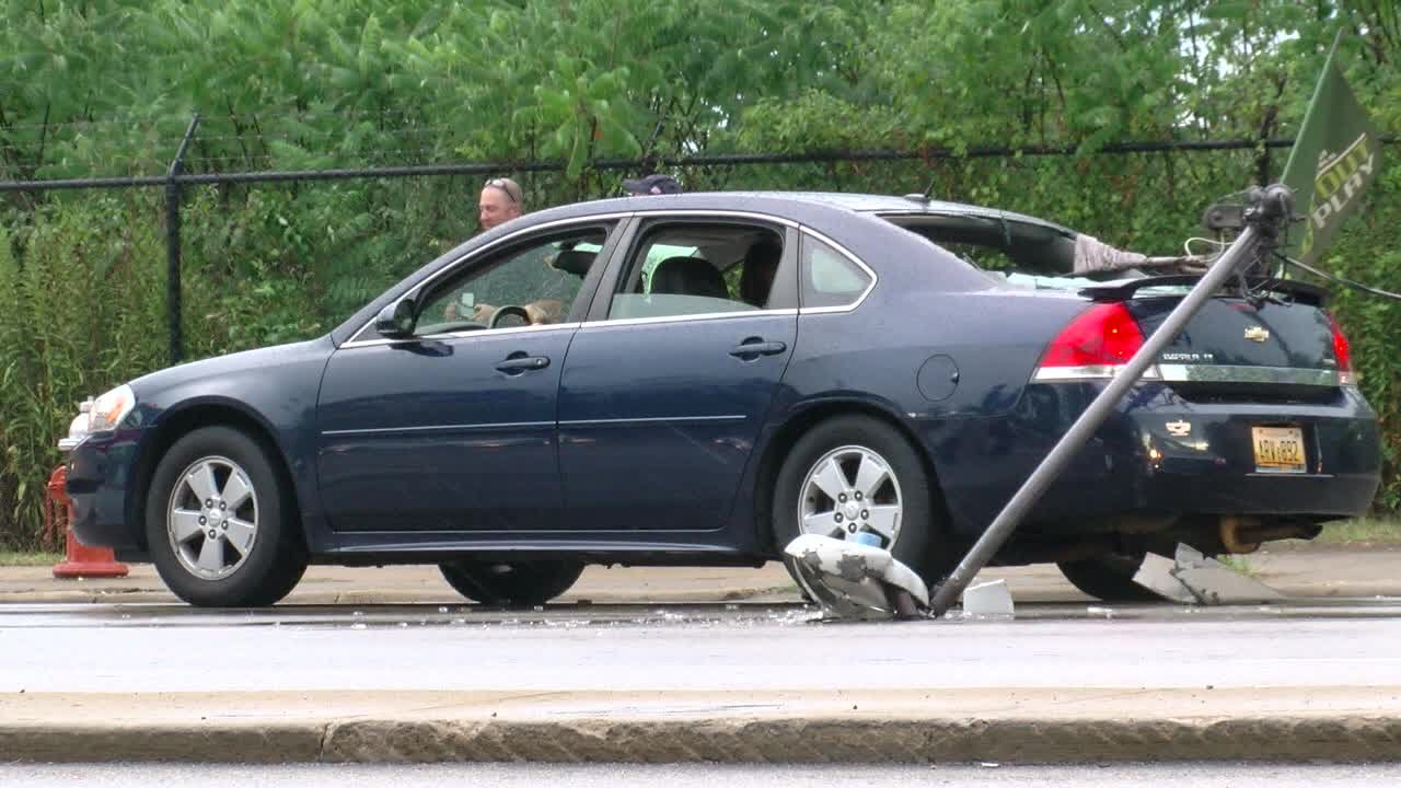 Light pole crashes into car, barely misses girl - YouTube