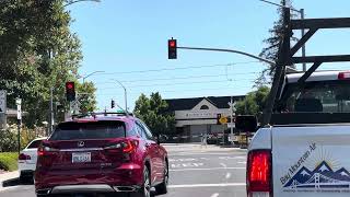 Southbound VTA Green Light Rail crosses Orchard City Drive