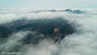 "Sea of clouds" form over scenic mountains in China