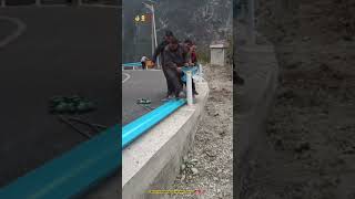 No Technology Help - Villagers Bending And Installing Highway Guardrail For Their Road