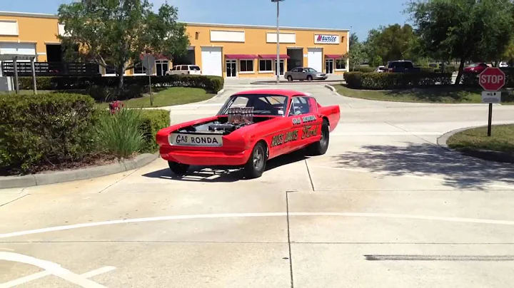 Gas Ronda Mustang pulling up.