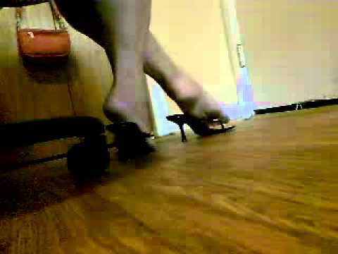Playing with shoes under Chair.wmv