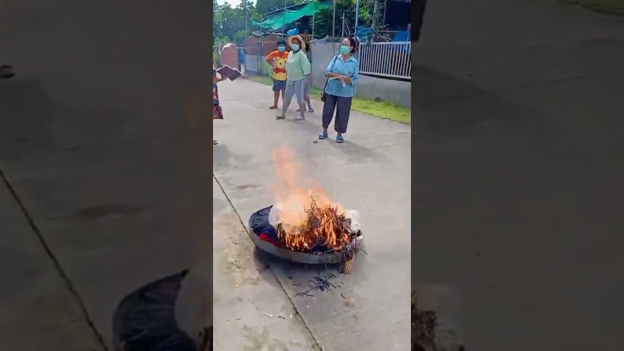 7 animist/Buddhist converts to Christianity burning their idols and fetishes.