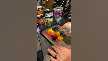 Rolling out multiple ink colors for letterpress printing.