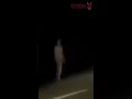 HUMANOID CREATURE WALKING ALONG ROAD: VIRAL VIDEO SHOWS GIANT HORRIFIC DARK EARTH EVIL DEVIL GHOUL