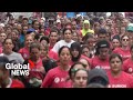 Thousands of women race through Lisbon streets to support fight against cancer