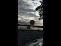 Insane footage shows hot air balloon crashing into power lines before landing in lake