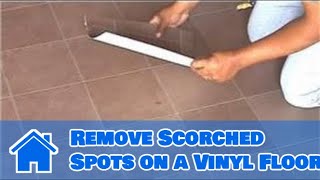 Scorched spots on a vinyl floor can be caused by something like
cigarette or other heat source. remove with help from flo...