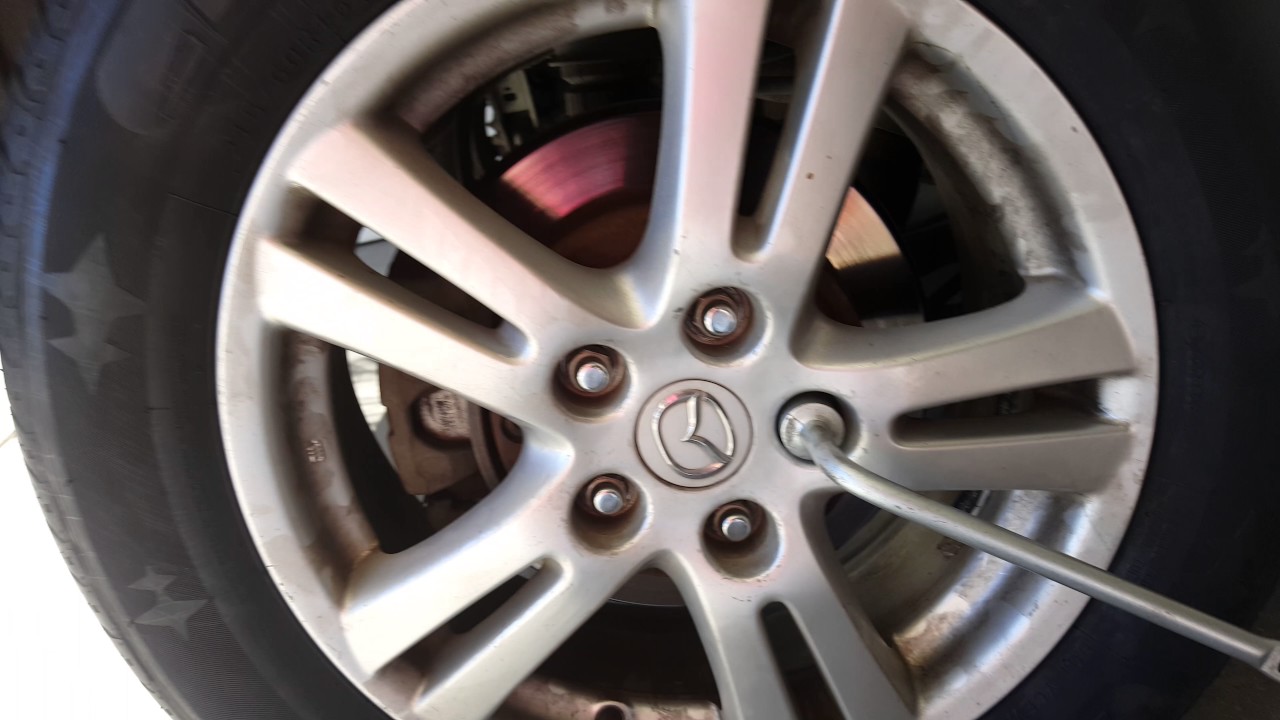 How To Change A Tire On A Mazda Mpv Part 2 Youtube