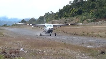 Exsternal View Susi Air Cessna Grand Caravan C208B Landing in Bilogai Sugapa Kab Intan Jaya Papua
