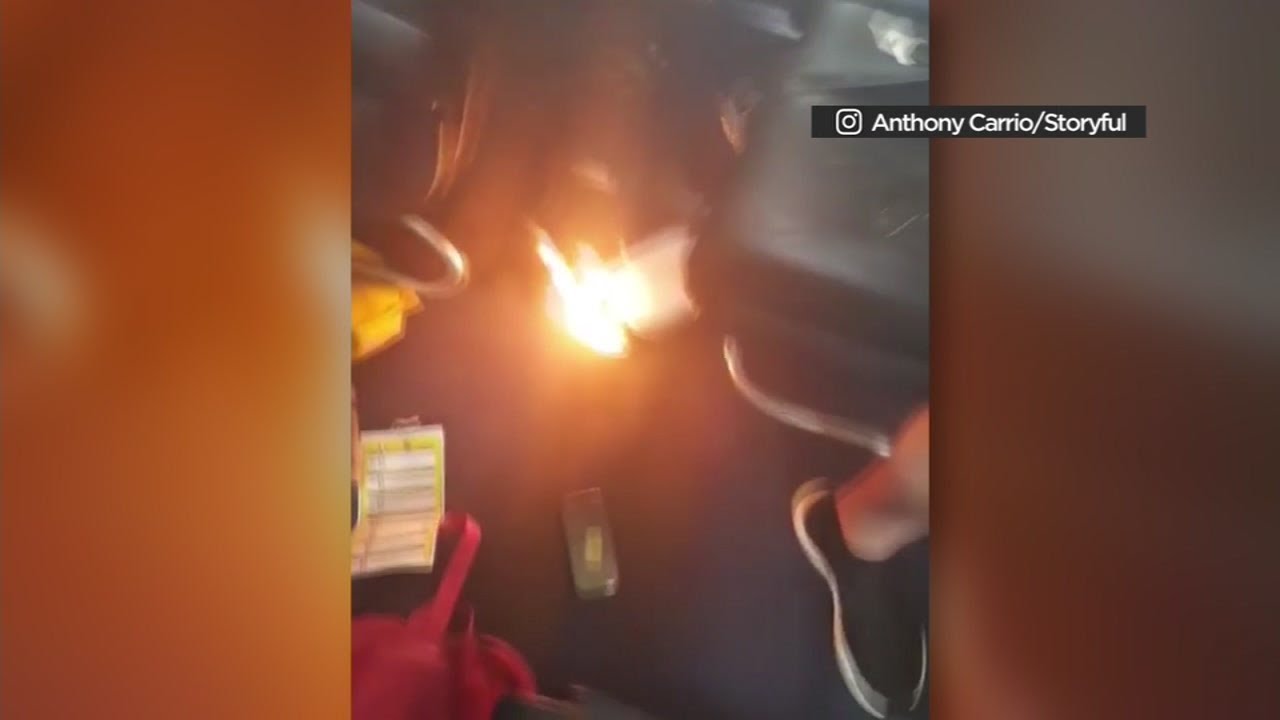 VIDEO Cellphone charger stirs panic after catching fire on plane YouTube