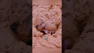 Girl Hides In Mud