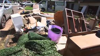 Resident forced to chuck personal belongings away amid clean up operations in northwest Sydney