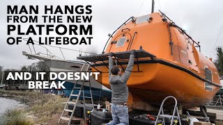 Man hangs from a new DIY expedition boat stern platform. Lifeboat conversion Ep124 [4K]