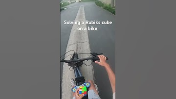 Solving a Rubik‘s cube on a bike #bike #shortsyoutube #rubikscube #gancube#speedcubing￼#super73