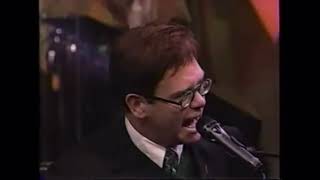 Elton John post surgery falsettos and high notes .
