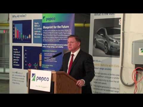 Joe Rigby, Pepco Holdings, Inc., Chairman of the Board, President & CEO showcases the Chevy Volt and its charging station. Ten Volts will be the newest additions to PHI's vehicle fleet.