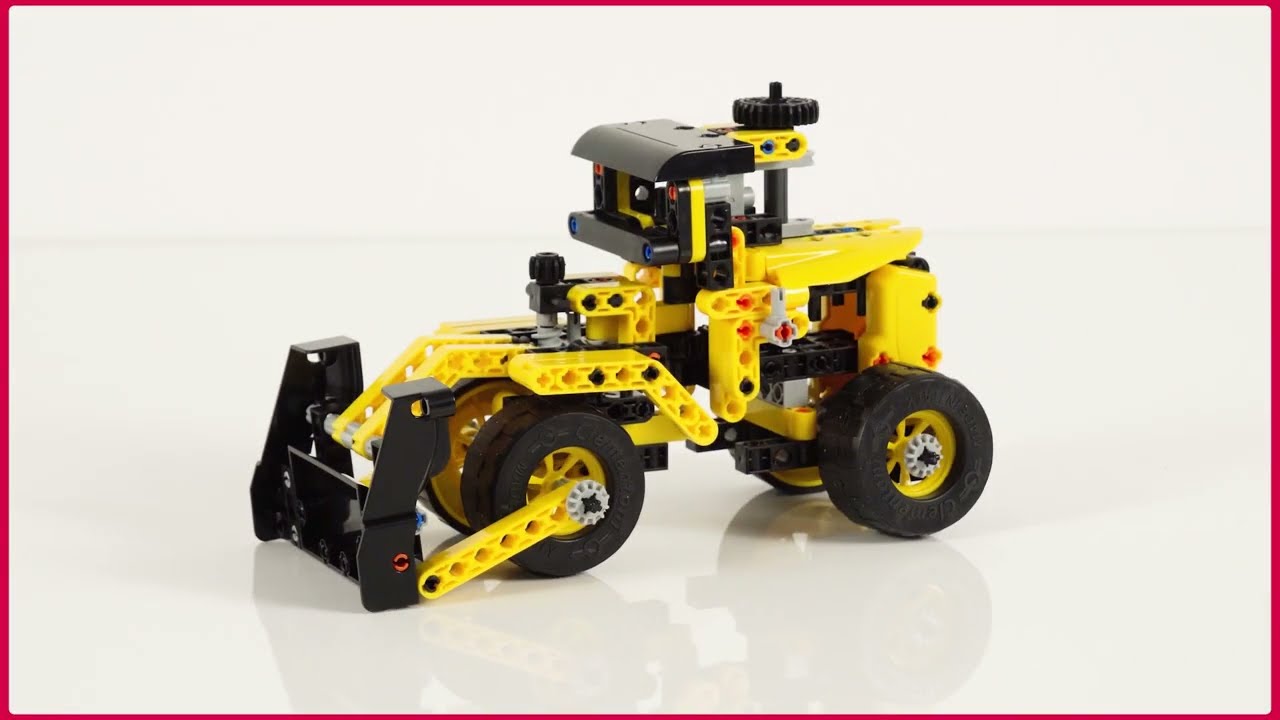 Un bulldozer mécanique en miniature de style jouet rétro réalisé en
